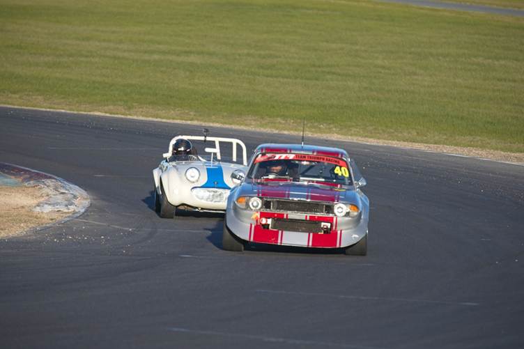 The V8 Triumph Stag and AH Sprite battle it out.